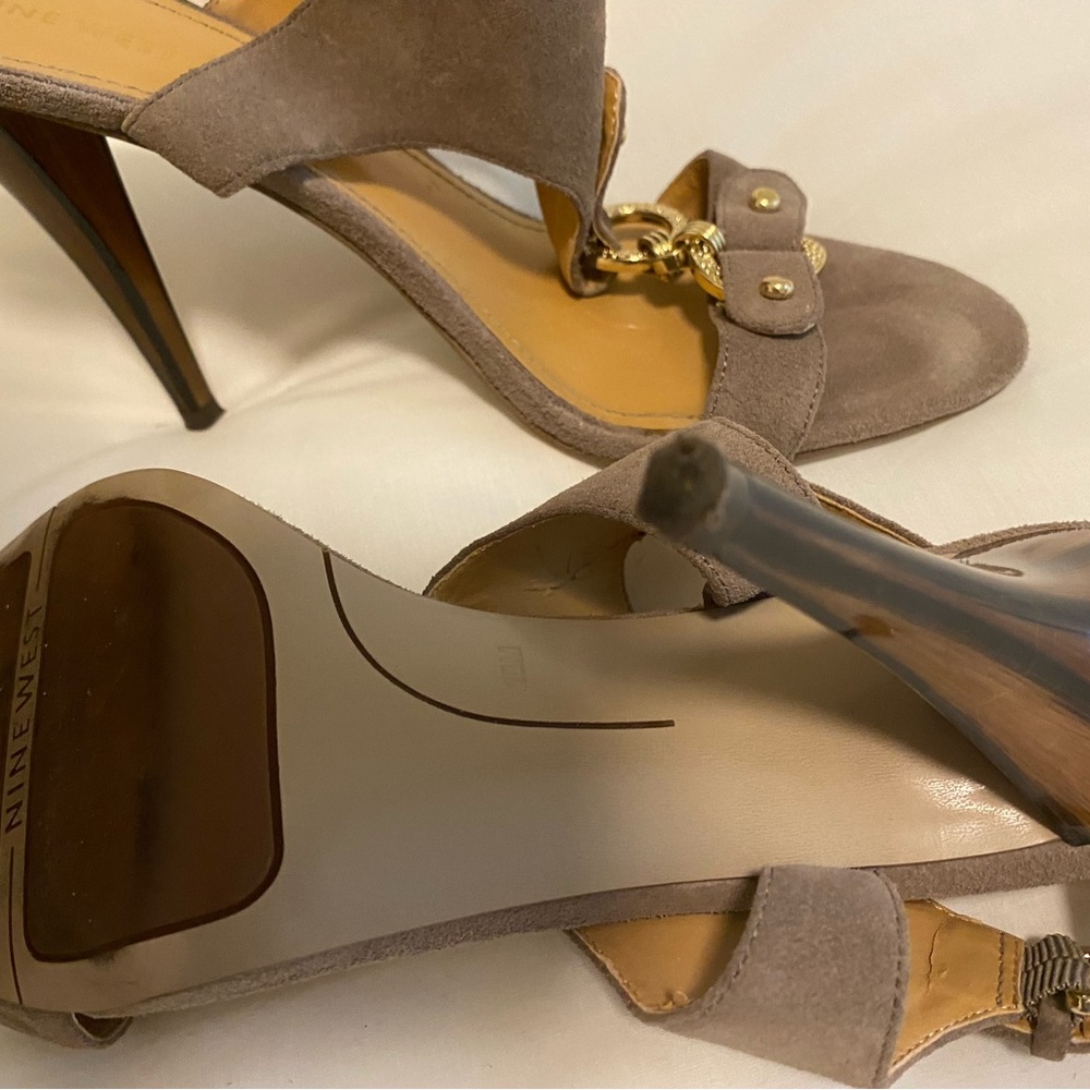Size 10 Nine West dressy shoe. Stacked heel. Some wear on inside strap.